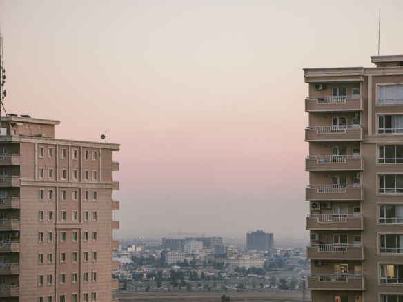 Scenic view of city skyline with high-rise buildings during a serene dusk.