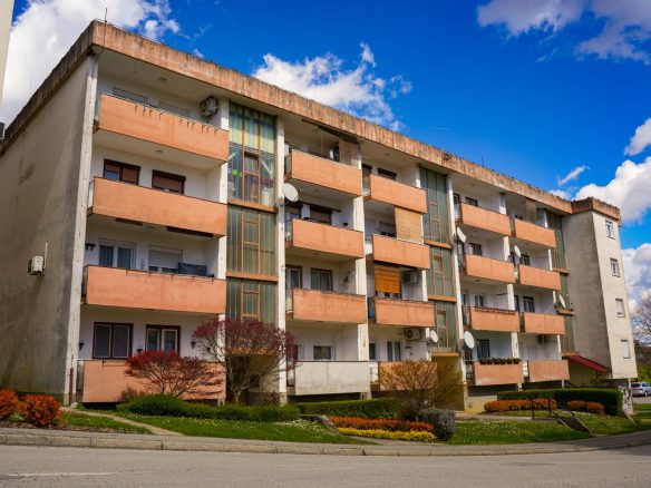 Charming residential building in Garešnica, Croatia, under a clear blue sky.