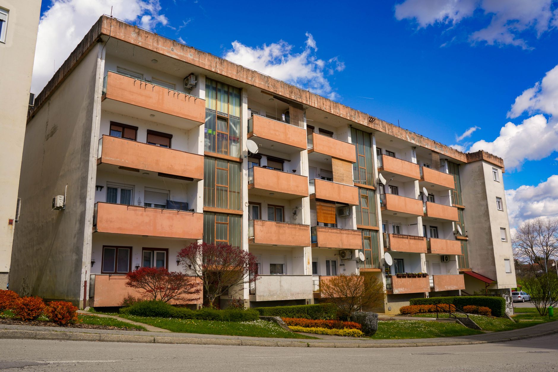 Charming residential building in Garešnica, Croatia, under a clear blue sky.