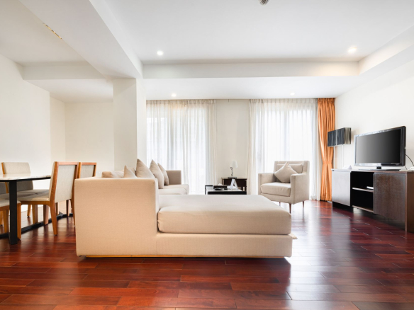 Elegant and airy living room with modern furniture and natural light.