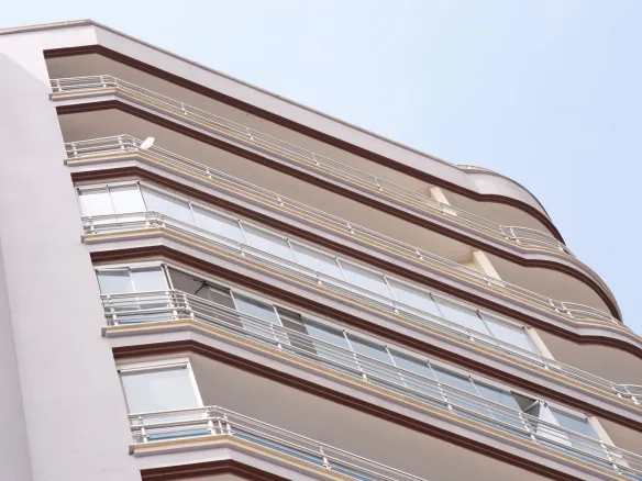 Low angle view of a modern apartment building in İzmir, showcasing residential urban architecture.